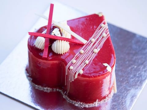 Raspberry madeleine cake with vanilla mousse and a red glaze