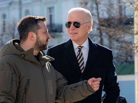President Joe Biden, right, and Ukrainian President Volodymyr Zelenskyy talk during an unannounced visit in Kyiv, Ukraine, Monday, Feb. 20, 2023.