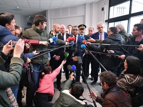 French Education and Youth Minister Pap Ndiaye (C) and French Minister for Transformation and Public Services Stanislas Guerini (L) speak to the press at Saint-Thomas d’Aquin middle school.