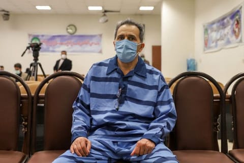 In this file photo taken on February 6, 2022, Jamshid Sharmahd, who is accused by the Iranian government of being a leader of the US-based "Tondar terrorist group" behind a deadly attack in Iran in 2008, attends the first hearing of his trial in Tehran.  