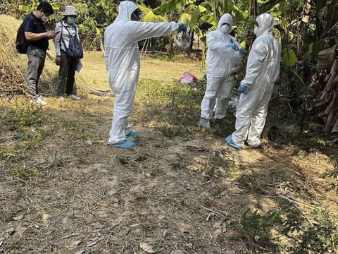 In this photo released by the Cambodia Ministry of Health, Cambodia health experts spray disinfectant at a village in Prey Veng eastern province Cambodia, Friday, Feb. 24, 2023.  