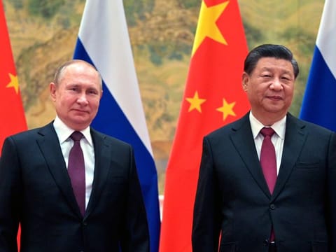 Chinese President Xi Jinping, right, and Russian President Vladimir Putin prior to their talks in Beijingon February  4, 2022. One year into war, China is offering a 12-point proposal to end the fighting.  