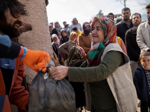 People affected by the deadly earthquake receive aid in Hatay, Turkey, February 24, 2023.  