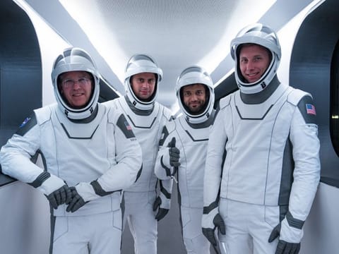 Emirati astronaut Sultan Al Neyadi (second from right) standing for photographer along with other astronauts of his Crew-6 team who will blast off to space on Feb. 27 from US.