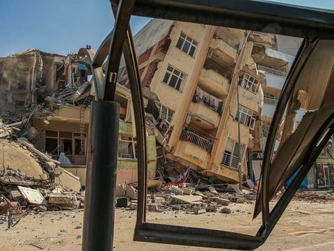 In this file picture, a destroyed building leans on a neighbouring house following the earthquake in Samandag, southern Turkey, Wednesday, Feb. 22, 2023. 
