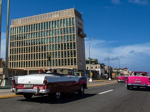 Tourists ride classic convertible cars on the Malecon beside the United States Embassy in Havana, Cuba, Oct. 3, 2017. U.S. intelligence agencies cannot link a foreign adversary to any of the incidents associated with so-called “Havana syndrome,” the hundreds of cases of brain injuries and other symptoms reported by American personnel around the world. 