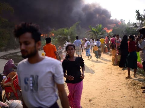 Rohingya refugees try to salvage their belongings after a major fire in their Balukhali camp at Ukhiya in Cox's Bazar district, Bangladesh, earlier this year. A massive fire raced through a crammed camp of Rohingya refugees in southern Bangladesh on Sunday, leaving thousands homeless, a fire official and the United Nations said. 