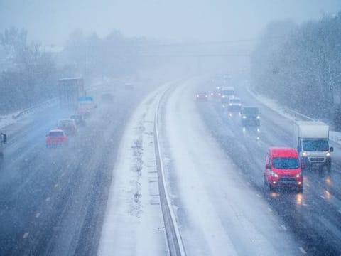 Cars driving through snow on the northbound carriageway of the M5 motorway near Taunton, which has been reduced to two lanes due to snow, as parts of the UK wake up to snow and a yellow weather warning, Wednesday March 8, 2023.