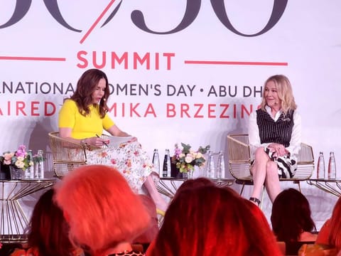 Emmy Award-winning actress Catherine O'Hara (r), famed for her role on Schitt's Creek, discusses her journey in television at the 30/50 Summit in Abu Dhabi.