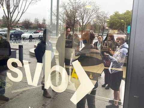 People line up outside the shuttered Silicon Valley Bank (SVB) headquarters in Santa Clara, California.