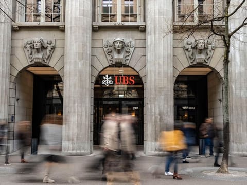 UBS and Credit Suisse Group AG are opposed to a forced combination, even as scenario planning for a government-orchestrated tie-up continues, according to people with knowledge of the matter.