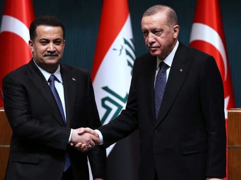 Turkish President Recep Tayyip Erdogan (right) and Iraqi Prime Minister Mohammad Shia Al Sudani shaking hands during a joint press conference after their meeting at the Presidential Palace in Ankara on March 21, 2023.  