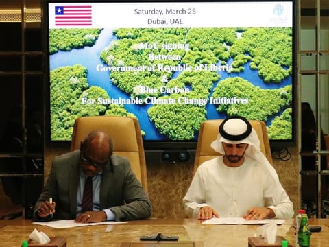 Samuel D. Tweah Jr., Liberia's Minister of Finance and Development Planning and Chair of National Climate Change with Sheikh Ahmed Dalmook Al Maktoum, Chairman of Blue Carbon