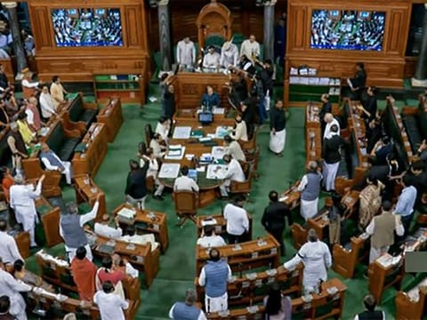 Opposition MPs stage a protest in the well of Lok Sabha demanding a JPC inquiry into the Adani Group issue and against the disqualification of Congress' Rahul Gandhi as MP, during the second phase of the Budget Session of Parliament, in New Delhi on Tuesday, March 28, 2023.