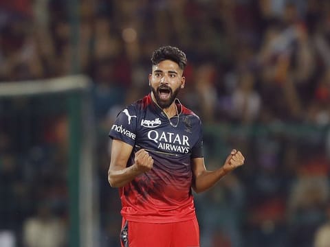 Royal Challengers Bangalore's Mohammad Siraj celebrates a wicket in a match against Mumbai Indians.