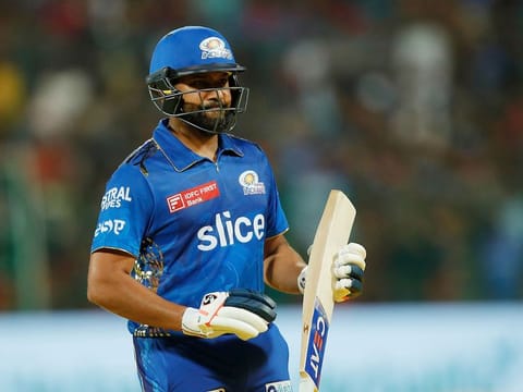 Rohit Sharma of Mumbai Indians returns to the dugout after being dismissed in the IPL match against the Royal Challengers Bangalore at the M. Chinnaswamy Stadium, Bengaluru, on April 2, 2023. Sharma’s lack of runs affects the scoring in the powerplay for Mumbai. 