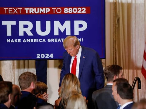  Former US President Donald Trump walks off stage after delivering remarks on the day of his court appearance in New York after being indicted by a Manhattan grand jury following a probe into hush money paid to porn star Stormy Daniels, in Palm Beach, Florida on April 4, 2023. 