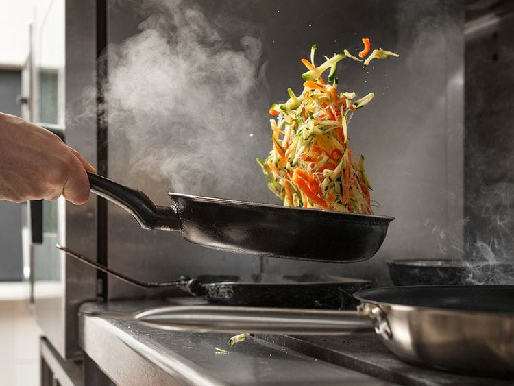 Flipping food in pan