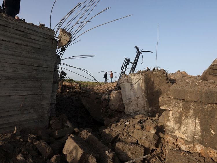 People inspect the damage following Israeli air strikes, in Ras al-Ain, southern Lebanon, April 7, 2023