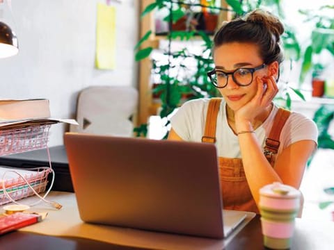 Woman looks into her computer