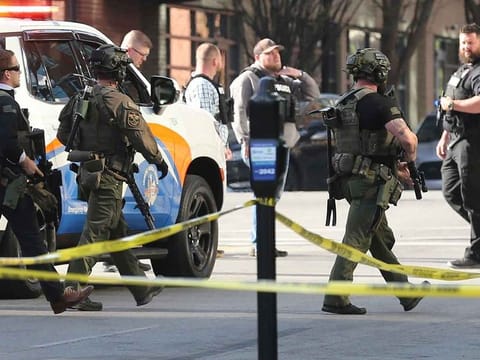 Police deploy at the scene of a mass shooting near Slugger Field baseball stadium in downtown Louisville, Kentucky, US April, 10, 2023.   