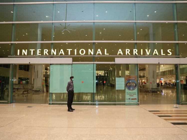 Airport Security Force (ASF) personnel at the International arrivals area at Islamabad International Airport, Pakistan. Photo taken on May 5, 2020. 