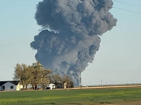 Smoke rises at the Southfork Dairy Farms, after an explosion and a fire killed around 18,000 cows, near Dimmitt, Texas. 