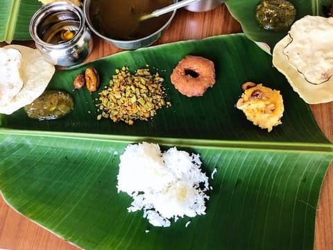A complete Puthandu feast served on fresh banana leaf
