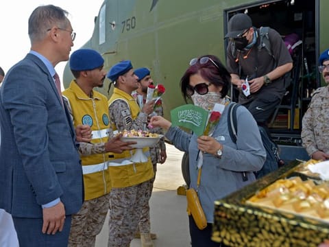 South Korean diplomats, who fled from chaos-torn Sudan, disembark from a military plane upon landing at King Abdullah Air Base in Jeddah on April 24, 2023.  