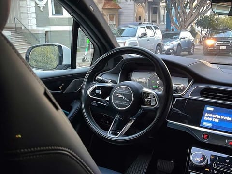 A Waymo driverless taxi drives on the street during a test ride in San Francisco, on Feb. 15, 2023. Cruise, a subsidiary of General Motors, and Waymo, a spinoff from Google, both are on the verge of operating 24-hour services that would transport passengers throughout one of the most densely populated U.S. cities in vehicles that will have no one sitting in the driver’s seat. (For illustrative purposes only)