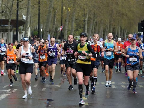 Participants near the finish of the 2023 London Marathon in central London on April 23, 2023.  While consistent physical training should be enough to allow anyone to run a marathon, running such a distance as 26.2 miles (42.195 kilometres) requires more than physical stamina.