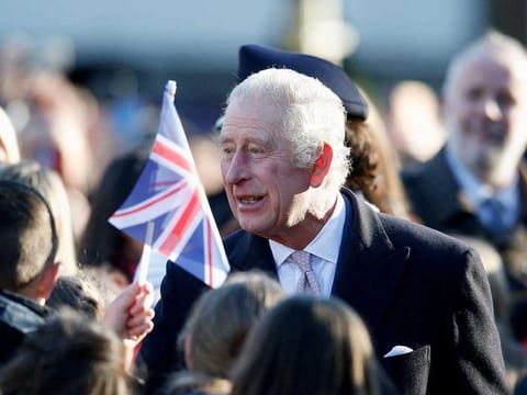 Britain's King Charles greets people as he arrives to visit the Bolton Town Hall, in Bolton, Britain January 20, 2023. 