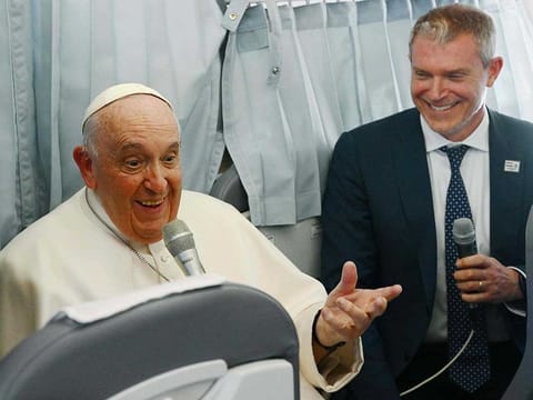 Pope Francis speaks to journalists during the flight from Budapest to Italy on April 30, 2023, after his second visit to Hungary in less than two years. 