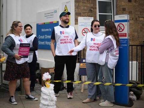 Members of the Royal College of Nursing (RCN) union man a picket line outside Great Ormond Street Hospital for Children in London on May 1, 2023 as they continue their industrial action. 