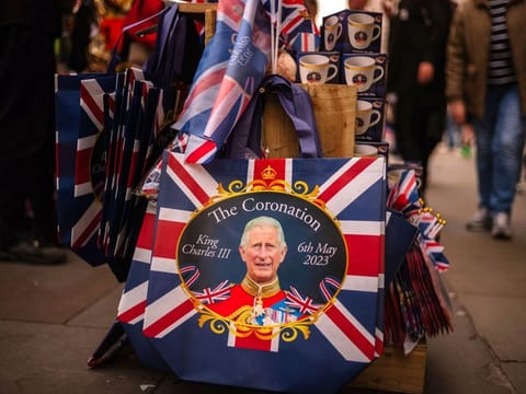 Royal and coronation related merchandise on sale at a street stall in Picadilly Circus in London, UK, on April 30, 2023. The coronation is a religious event which celebrates the start of King Charles III’s reign. 