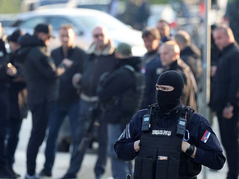 Police secure location of a shooting, in Dubona, Serbia, May 5, 2023.   