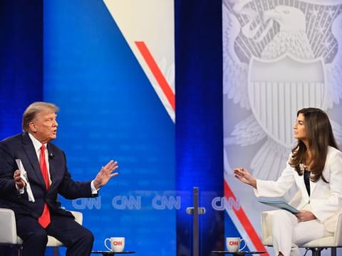 Former president Donald Trump and CNN moderator Kaitlan Collins at a CNN town-hall event in Manchester, N.H., on May 10, 2023. 