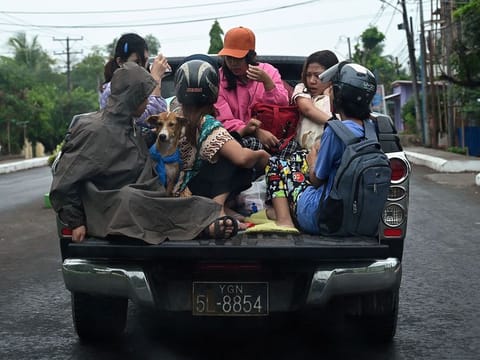 People evacuate in Sittwe in Myanmar's Rakhine state  ahead of the landfall of Cyclone Mocha. 