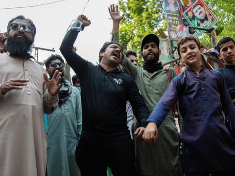 Supporters of Imran Khan, former Pakistan premier, celebrate his release outside his Zaman Park residence in Lahore, Pakistan, on Friday, May 12, 2023. 
