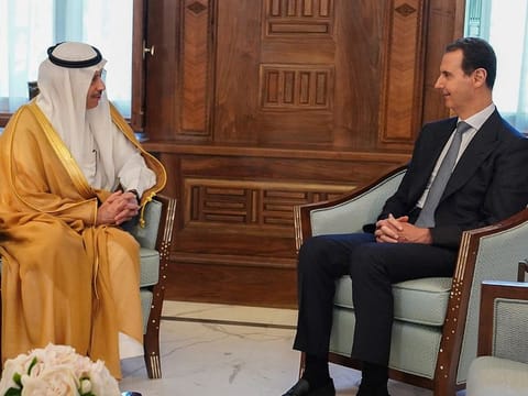Syrian President Bashar Al Assad, right, with Saudi Arabia ambassador to Jordan Nayef Al Sadiri, in Damascus, on May 11, 2023. Assad received an invitation from Saudi Arabia to attend the upcoming Arab League summit.