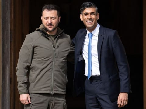 Britain's Prime Minister Rishi Sunak (right) greets Ukraine's President Volodymyr Zelensky at Chequers, the prime minister's official country residence, near Ellesborough, northwest of London, on May 15, 2023. Ukraine's President Volodymyr Zelensky arrived in Britain on Monday to meet Prime Minister Rishi Sunak, who pledged "hundreds" of both air-defence missiles and long-range attack drones to fend off Russia's attacks.  