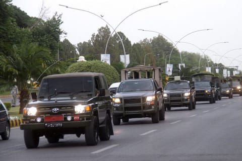 Pakistan Army vehicles patrol during a flag march, ahead of Pakistan's former Prime Minister Imran Khan's appearance in the Supreme Court in Islamabad, Pakistan May 11, 2023.  