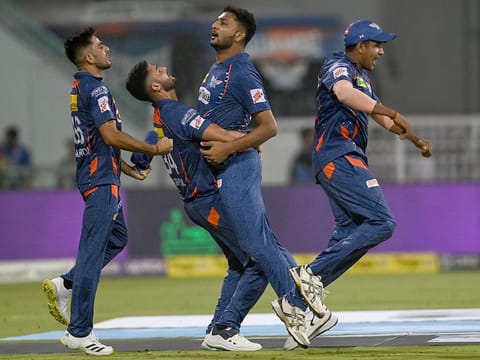 Lucknow Super Giants' Mohsin Khan (C) with teammates celebrate after their team win in the IPL match Mumbai Indians at the Ekana Cricket Stadium in Lucknow on May 16, 2023. 