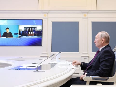 Russian President Vladimir Putin, together with Iranian President Ebrahim Raisi, takes part in the ceremony of signing an agreement on the construction of the Rasht-Astara railway, via video link at the Kremlin in Moscow, Russia May 17, 2023.  