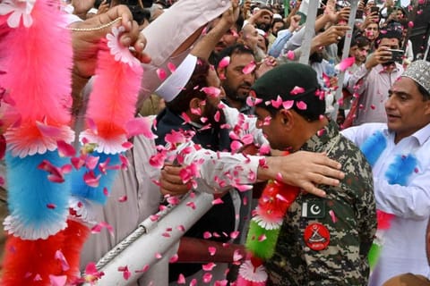 People take part in a rally to show solidarity with Pakistan's army in Peshawar on May 17, 2023, after military installations were allegedly damaged by supporters of former Pakistan's prime minister Imran Khan following his arrest last week.  