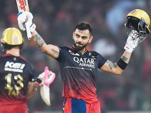 Royal Challengers Bangalore's Virat Kohli celebrates after scoring a century during the IPL match against Sunrisers Hyderabad at the Rajiv Gandhi International Stadium in Hyderabad on May 18, 2023. 