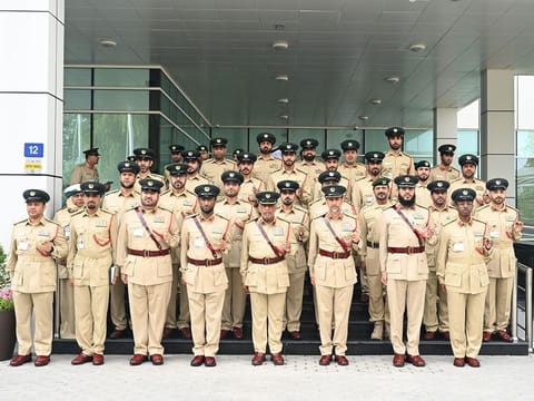 Al Khawaneej Police Station staff with Lieutenant General Abdullah Khalifa Al Marri, Commander-in-Chief of Dubai Police, during an inspection visit to the station. 