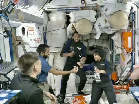 Al Neyadi (second from left) welcomes the Saudi crew members 