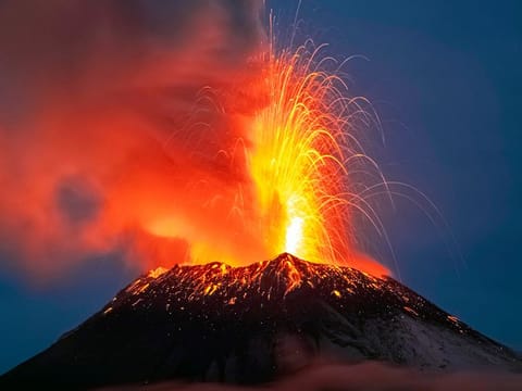 Incandescent materials, ash and smoke are spewed from the Popocatepetl volcano as seen from the Santiago Xalitzintla community, state of Puebla, Mexico.  