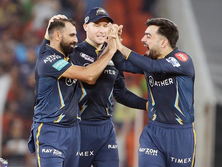 Gujarat Titans' Mohammad Shami celebrates the dismissal of Mumbai Indians skipper Rohit Sharma 